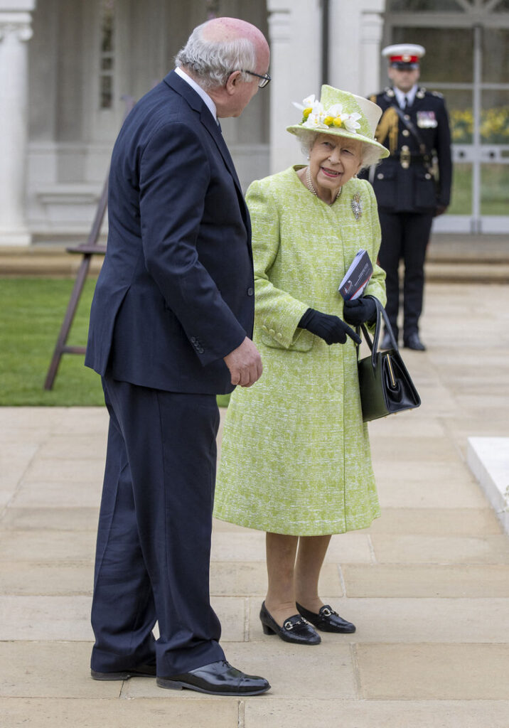 Queen Elizabeth II accompanied by the Honourable George Brandis (left), High Commissioner for Australia, attends a service to mark the Centenary of the Royal Australian Air Force at the CWGC Air Forces Memorial in Runnymede, Surrey. UK on March 31, 2021.