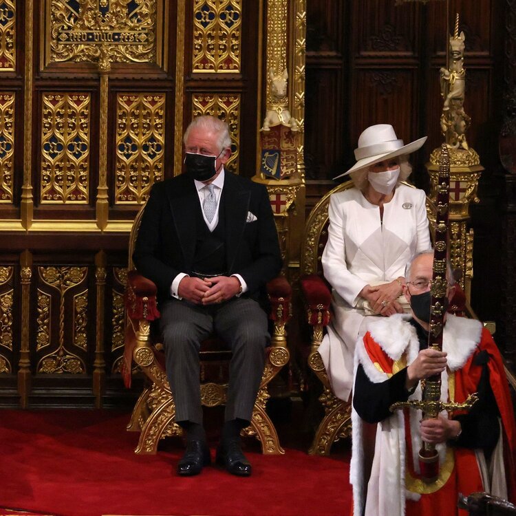 Britain’s Queen Elizabeth II (C) sits on the The Sovereign’s Throne in the House of Lords chamber during the State Opening of Parliament at the Houses of Parliament in London on May 11, 2021, which is taking place with a reduced capacity due to Covid-19 restrictions. – The State Opening of Parliament is where Queen Elizabeth II performs her ceremonial duty of informing parliament about the government’s agenda for the coming year in a Queen’s Speech.