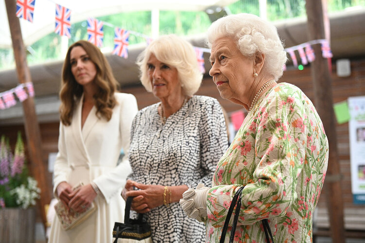 Britain’s Catherine, Duchess of Cambridge (L), Britain’s Camilla, Duchess of Cornwall (C) and Britain’s Queen Elizabeth II meet people from communities across Cornwall at an event in celebration of The Big Lunch initiative at The Eden Project, near St Austell in south west England on June 11, 2021.